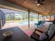 View of the screened-in pool with covered patio and outdoor seating area at 20249 Macon Pkwy, Orlando, FL 32833