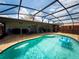 Backyard screened-in pool with an inflatable, and outdoor patio furniture at 20249 Macon Pkwy, Orlando, FL 32833