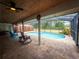 Screened-in pool with spacious patio, and covered lounging area at 20249 Macon Pkwy, Orlando, FL 32833