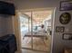 View from inside a bedroom, looking out to the pool and patio, bringing outdoor tranquility in at 20249 Macon Pkwy, Orlando, FL 32833