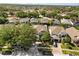A vibrant aerial view of the neighborhood showcases homes with tree-lined streets at 206 Bonville Dr, Davenport, FL 33897