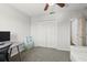 Cozy bedroom featuring carpet, a closet, and desk at 206 Bonville Dr, Davenport, FL 33897