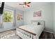 Bright bedroom with beach themed decor, hardwood floors, and natural lighting at 206 Bonville Dr, Davenport, FL 33897
