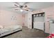 Bright bedroom featuring floral accents, closet, and white dresser at 206 Bonville Dr, Davenport, FL 33897