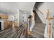 Open concept home showcasing staircase, modern flooring, and easy access to the kitchen at 206 Bonville Dr, Davenport, FL 33897
