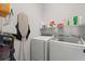 Bright laundry room featuring a washer and dryer at 206 Bonville Dr, Davenport, FL 33897