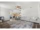 Bright living room featuring modern flooring, neutral paint, and an open floor plan at 206 Bonville Dr, Davenport, FL 33897