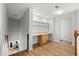 Loft space features a built-in desk, hardwood floors, and an open staircase at 206 Bonville Dr, Davenport, FL 33897
