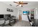 Home office space with keyboard, dual monitors, and view to the hallway at 206 Bonville Dr, Davenport, FL 33897