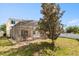 An exterior view of the screened-in pool and backyard, with the house in the background at 206 Bonville Dr, Davenport, FL 33897