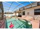 Exterior of the home featuring a sparkling pool with beach toys and a lounging patio at 206 Bonville Dr, Davenport, FL 33897