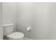 Powder room features a toilet and gray walls at 206 Bonville Dr, Davenport, FL 33897