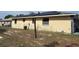 Exterior view of the home's backyard with a grass lawn and solar panels at 2117 Lemon St, Haines City, FL 33844