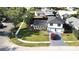 An aerial view showcases the home's two-story layout, pristine lawn, and convenient driveway at 2227 Coventry Dr, Winter Park, FL 32792