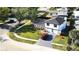 Aerial view of this home boasting a well-maintained lawn, mature trees, and a private driveway at 2227 Coventry Dr, Winter Park, FL 32792