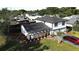 Sweeping aerial highlights a green lawn and unique home exterior design at 2227 Coventry Dr, Winter Park, FL 32792