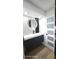 Bathroom featuring a modern vanity with an LED mirror and stylish black faucet at 2227 Coventry Dr, Winter Park, FL 32792