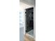 Bathroom featuring a shower with black marble tiling and glass enclosure at 2227 Coventry Dr, Winter Park, FL 32792