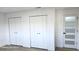 Bedroom with natural lighting, multiple closets, and interior door with multi-pane glass at 2227 Coventry Dr, Winter Park, FL 32792