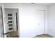 Bedroom view featuring white walls, light wood flooring, and a closet door at 2227 Coventry Dr, Winter Park, FL 32792