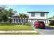 Beautiful two-story home featuring a well-kept lawn and neat landscaping at 2227 Coventry Dr, Winter Park, FL 32792