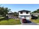 Two story home boasts a well manicured lawn and updated facade at 2227 Coventry Dr, Winter Park, FL 32792