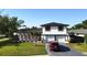 Two story home boasts a well manicured lawn and updated facade at 2227 Coventry Dr, Winter Park, FL 32792