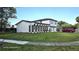 Inviting two-story home with a beautiful lawn, showcasing the front facade at 2227 Coventry Dr, Winter Park, FL 32792