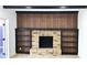 Brick fireplace with flanking bookshelves and wood paneling for a cozy, traditional focal point at 2227 Coventry Dr, Winter Park, FL 32792
