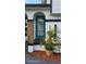A contemporary front entrance with a turquoise door and modern planters at 2227 Coventry Dr, Winter Park, FL 32792