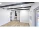 Open-concept living space with wood-look flooring, a staircase, and neutral color palette at 2227 Coventry Dr, Winter Park, FL 32792