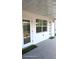 Enclosed porch, a full view window, neutral walls and doors, plus a small rug leading outside at 2227 Coventry Dr, Winter Park, FL 32792