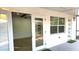 Enclosed porch with neutral walls, multiple windows and door with a full view of the interior of the property at 2227 Coventry Dr, Winter Park, FL 32792