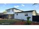 The rear exterior shows a screened in porch, a two story layout and a fenced in backyard at 2227 Coventry Dr, Winter Park, FL 32792
