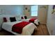 Bright bedroom featuring twin beds with stylish Mickey Mouse themed decor, creating a fun and inviting space at 228 Captiva Dr, Davenport, FL 33896