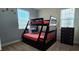 Charming ' bedroom featuring a bunk bed and dresser, adorned with playful sea-themed decor for an imaginative space at 228 Captiva Dr, Davenport, FL 33896