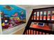 Enchanting ' bedroom featuring a custom mural, comfortable bunk beds and ocean-themed decor creating a vibrant and playful atmosphere at 228 Captiva Dr, Davenport, FL 33896