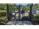 View of the pool entrance through a decorative gate along with the pool rules for safety and enjoyment at 228 Captiva Dr, Davenport, FL 33896