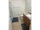 Bathroom with a glass-enclosed shower, toilet, and vanity, providing a clean and functional space at 2305 Chatham Place Dr, Orlando, FL 32824