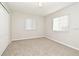 Inviting bedroom features two sunny windows, neutral carpet, and a closet at 2305 Chatham Place Dr, Orlando, FL 32824