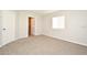 Neutral bedroom features carpeted floor and a doorway leading to an ensuite bathroom at 2305 Chatham Place Dr, Orlando, FL 32824