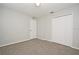 Bedroom with neutral carpeting and bright natural light from interior door and closet at 2305 Chatham Place Dr, Orlando, FL 32824