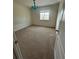 Carpeted bedroom with a window and overhead chandelier, ideal for a cozy retreat at 2305 Chatham Place Dr, Orlando, FL 32824