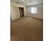 Bedroom featuring a built-in closet, window, and carpeted floor, creating a private and functional retreat at 2305 Chatham Place Dr, Orlando, FL 32824