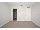 Bedroom featuring neutral carpet, walk-in closet, and interior door at 2305 Chatham Place Dr, Orlando, FL 32824