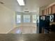 Bright dining area with large windows, tile flooring, and a modern chandelier at 2305 Chatham Place Dr, Orlando, FL 32824