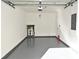 The garage has epoxy floor, water heater, electric panel, and room for vehicle parking at 2305 Chatham Place Dr, Orlando, FL 32824