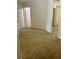 Hallway with neutral walls and flooring, showing access to other rooms in the house at 2305 Chatham Place Dr, Orlando, FL 32824
