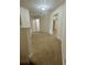 Spacious hallway features carpeted flooring and multiple doorways leading to various rooms at 2305 Chatham Place Dr, Orlando, FL 32824