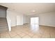Spacious open-concept living room featuring tile flooring and sliding glass doors at 2305 Chatham Place Dr, Orlando, FL 32824
